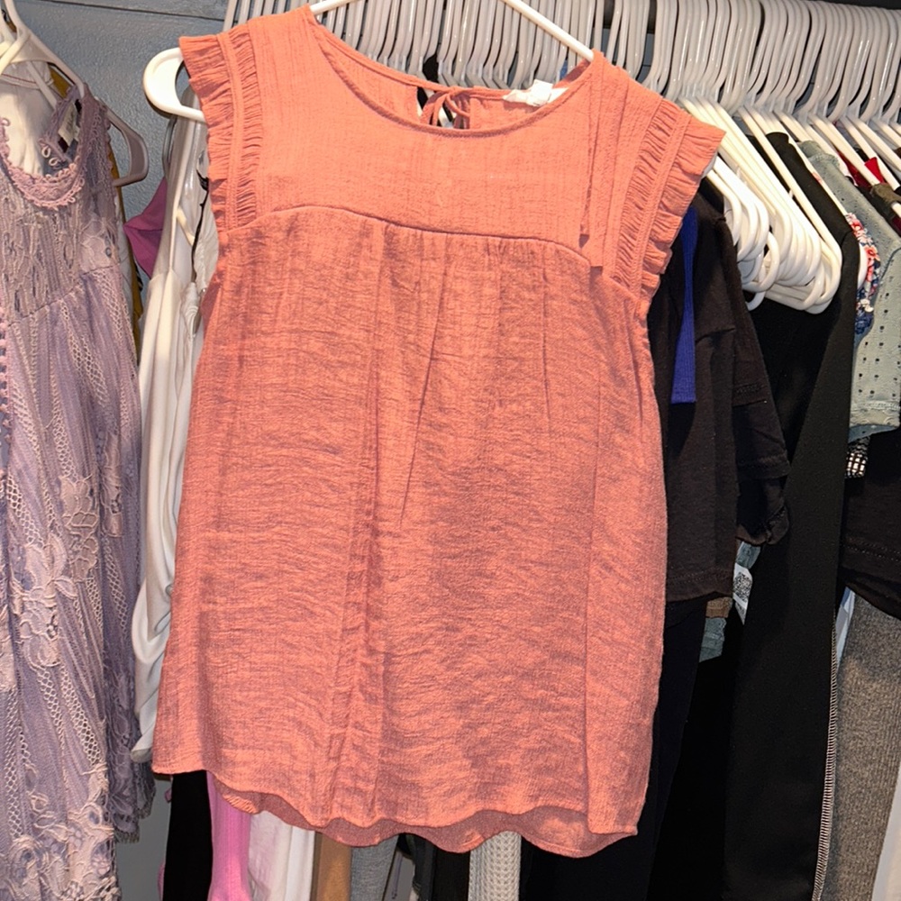 Woman’s pink top